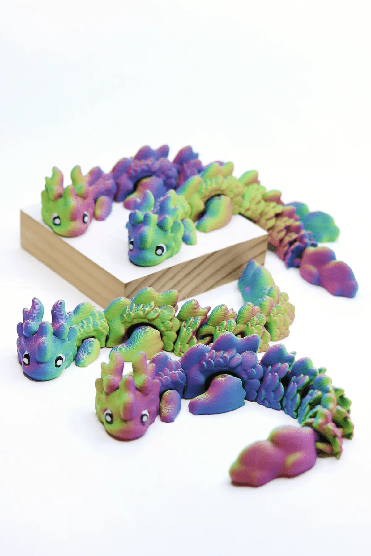 3D Printed Baby Axolotl Fidget Pet in Neon Rainbow